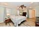 Spacious bedroom with an ensuite bath, ceiling fan, and lots of natural light at 11710 E 75Th St, Indianapolis, IN 46236