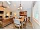 Cozy dining area adjacent to the living room with a wood table at 11710 E 75Th St, Indianapolis, IN 46236
