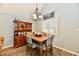 Dining area featuring a wooden hutch and table with chairs at 11710 E 75Th St, Indianapolis, IN 46236
