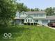 Charming two-story home with well-maintained lawn, mature trees, and attached two car garage at 11710 E 75Th St, Indianapolis, IN 46236