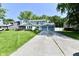 Charming two-story home with blue trim, attached garage, and lush green lawn at 11710 E 75Th St, Indianapolis, IN 46236