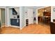 An inviting kitchen showcases classic hardwood floors and a breakfast bar with dark blue cabinets at 11710 E 75Th St, Indianapolis, IN 46236