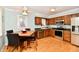 Traditional kitchen boasts wooden cabinetry, stainless steel appliances, and a cozy breakfast nook at 11710 E 75Th St, Indianapolis, IN 46236