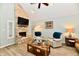 Comfortable living room featuring a stone fireplace and cozy seating at 11710 E 75Th St, Indianapolis, IN 46236