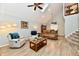 Vaulted ceiling living room with a stone fireplace, comfortable seating and open floor plan at 11710 E 75Th St, Indianapolis, IN 46236
