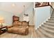 Open-concept living room with dining area, staircase and neutral color palette at 11710 E 75Th St, Indianapolis, IN 46236