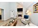 Bright living room featuring a stone fireplace, vaulted ceilings and natural light at 11710 E 75Th St, Indianapolis, IN 46236