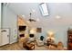 Bright living room with ceiling fan, skylight, stone fireplace and comfortable seating at 11710 E 75Th St, Indianapolis, IN 46236
