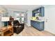 Bright living room with updated breakfast bar and a comfortable recliner at 11710 E 75Th St, Indianapolis, IN 46236