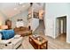 Bright and airy living room with vaulted ceilings, staircase and wood-look floors at 11710 E 75Th St, Indianapolis, IN 46236
