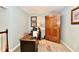 Bright office with a work desk, wood floors, and a vintage armoire at 11710 E 75Th St, Indianapolis, IN 46236