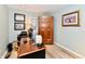 Bright office with a work desk, wood floors, and a vintage armoire at 11710 E 75Th St, Indianapolis, IN 46236