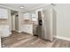 Kitchen with stainless steel refrigerator, ample counter space, and natural light from the window at 1310 Shadetree Ln, Sheridan, IN 46069