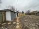 The backyard shows a detached garage, stone pavers, and wood fence at 3314 S Parker Ave, Indianapolis, IN 46237
