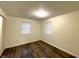 Bedroom featuring wood floors, fresh paint, mini blinds, and closet at 3314 S Parker Ave, Indianapolis, IN 46237