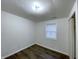 This bedroom features a window, wood flooring, and neutral walls at 3314 S Parker Ave, Indianapolis, IN 46237