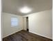 Bedroom featuring wood floors, fresh paint, mini blinds, and closet at 3314 S Parker Ave, Indianapolis, IN 46237