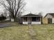 Charming home featuring a cozy front porch, fresh dark siding, and a well-maintained yard at 3314 S Parker Ave, Indianapolis, IN 46237
