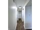 Hallway featuring wood floors, fresh paint, and closet at 3314 S Parker Ave, Indianapolis, IN 46237