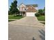 Two story home with brick facade, attached garage, and small front porch in a well-kept community at , Whitestown, IN 46075