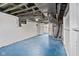 Unfinished basement with exposed pipes, mechanicals, and painted floor at 3950 W Michigan St, Indianapolis, IN 46222