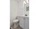 Bathroom featuring modern gray floors and toilet and vanity at 3950 W Michigan St, Indianapolis, IN 46222