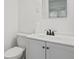 Bathroom featuring modern gray floors and toilet and vanity at 3950 W Michigan St, Indianapolis, IN 46222