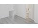 Bathroom featuring modern gray floors and an open doorway at 3950 W Michigan St, Indianapolis, IN 46222