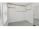 Spare bedroom featuring modern gray floors and built-in storage at 3950 W Michigan St, Indianapolis, IN 46222