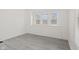 Bedroom featuring modern gray floors and built-in storage at 3950 W Michigan St, Indianapolis, IN 46222