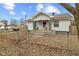 Charming home featuring a well-maintained lawn, fenced yard, and inviting front porch at 3950 W Michigan St, Indianapolis, IN 46222