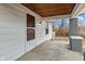 View of front porch with wood ceiling, brick columns, and a concrete floor at 3950 W Michigan St, Indianapolis, IN 46222