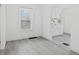 Compact kitchenette features white cabinets, sleek countertops, and a large window for natural light at 3950 W Michigan St, Indianapolis, IN 46222