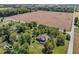 Aerial view of the property showcasing the home, expansive land, and surrounding landscape at 4030 W 193Rd St, Westfield, IN 46074