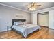 Bedroom featuring a queen bed, hardwood floors and a closet at 4030 W 193Rd St, Westfield, IN 46074