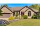 Charming brick home featuring manicured lawn, tasteful landscaping, and an attached two-car garage at 4030 W 193Rd St, Westfield, IN 46074