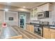 Well-equipped kitchen with stainless steel appliances, wood-look countertops, and convenient laundry area in view at 4030 W 193Rd St, Westfield, IN 46074