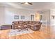 Spacious living room featuring hardwood floors, plush seating, and a staircase leading upstairs at 4030 W 193Rd St, Westfield, IN 46074