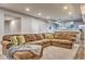 Comfortable living room featuring a large sectional sofa and an inviting view of the bar and kitchen area at 4030 W 193Rd St, Westfield, IN 46074