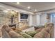 Inviting living room with a cozy fireplace, large TV, and comfortable sectional sofa, perfect for relaxing at 4030 W 193Rd St, Westfield, IN 46074