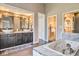 Main bath featuring double sinks, soaking tub and tiled shower at 4030 W 193Rd St, Westfield, IN 46074