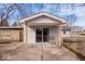 Covered back patio with sliding glass door access to home and seating area at 5053 Manker St, Indianapolis, IN 46227