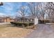 Charming single-story home with a well-manicured lawn and covered parking space at 5053 Manker St, Indianapolis, IN 46227