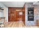 Kitchen featuring tiled accent wall and floor, laminate counters and ample wooden cabinets at 5053 Manker St, Indianapolis, IN 46227