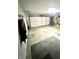 Well-lit garage with a large door, offering plenty of room for parking and workshop activities at 5430 Milhouse Rd, Indianapolis, IN 46221