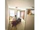 Kitchen and dining area featuring laminate flooring and oak colored kitchen cabinets at 5430 Milhouse Rd, Indianapolis, IN 46221