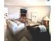 Bright and airy living room with comfortable seating and a large TV at 5430 Milhouse Rd, Indianapolis, IN 46221