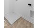 A glimpse of the basement utility access featuring tile flooring, utility box, and outlets at 567 Hidden Hills Dr, Pittsboro, IN 46167