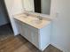 Bathroom with double sink vanity, quartz countertops, and modern faucets at 567 Hidden Hills Dr, Pittsboro, IN 46167