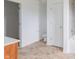 Bathroom with modern toilet, tile floor, tub and shower, and view to closet at 567 Hidden Hills Dr, Pittsboro, IN 46167
